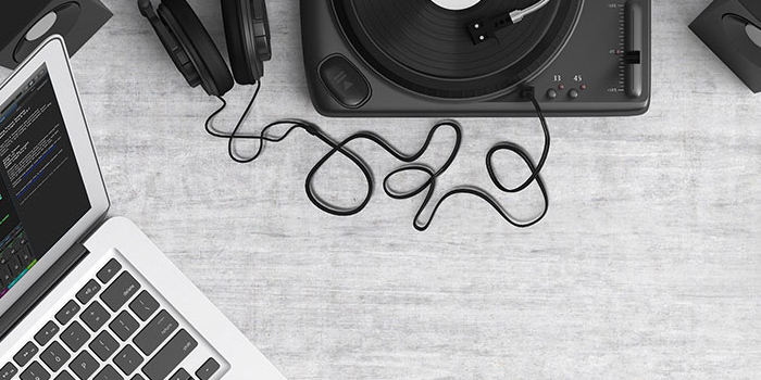 laptop and recording equipment on a desk